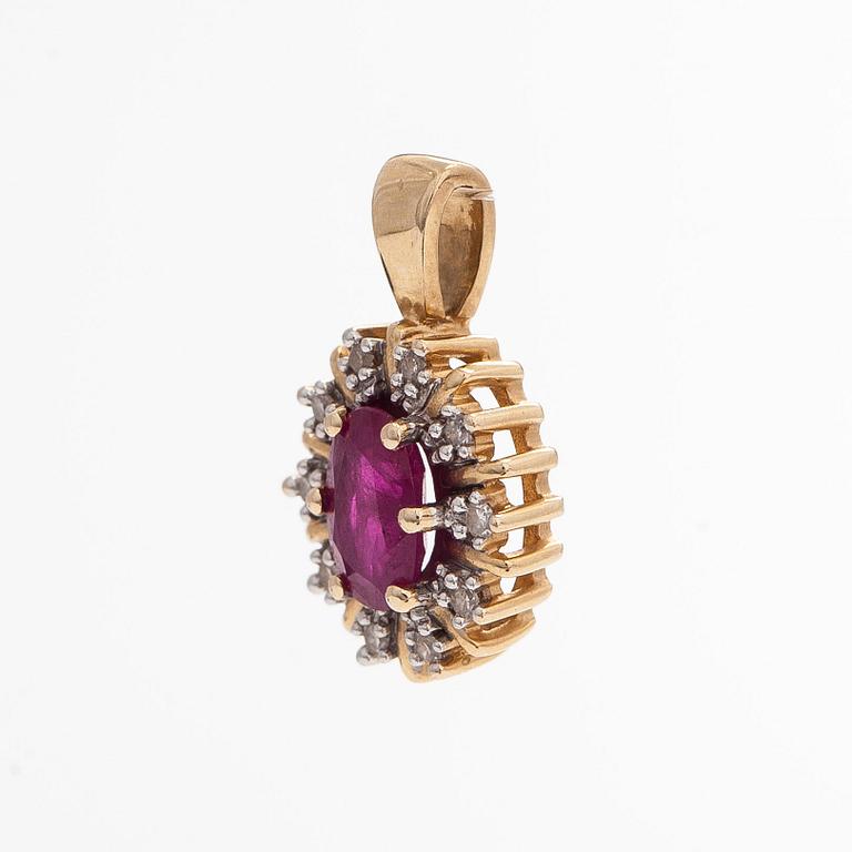 A 14K gold pendant, with an oval ruby and octagon-cut diamonds.