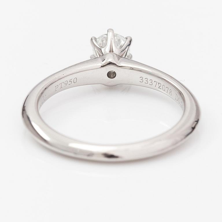 Tiffany & Co, A platinum ring with a ca. 0.26 ct diamond.