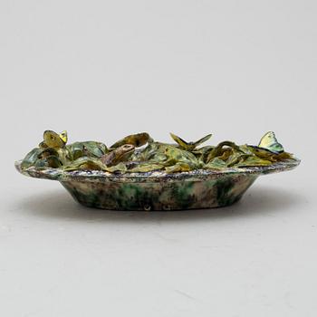 A richly decorated Palissy-style majolica plate, 19th century.
