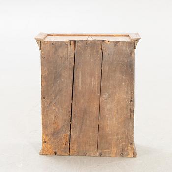 A Swedish painted wall cabinet around 1800.