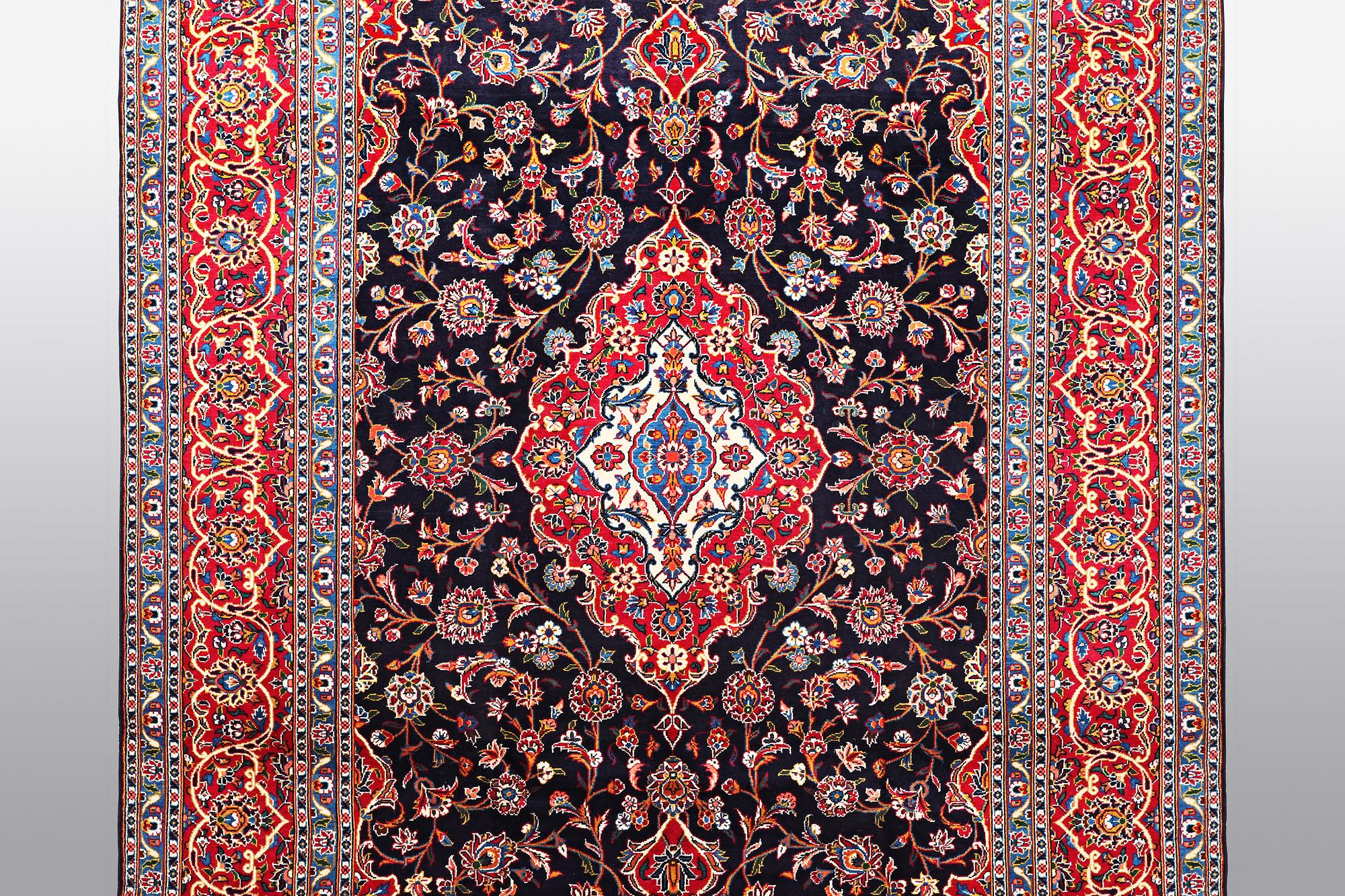 A carpet, Kashan signed Najafi, ca 360 x 231 cm.