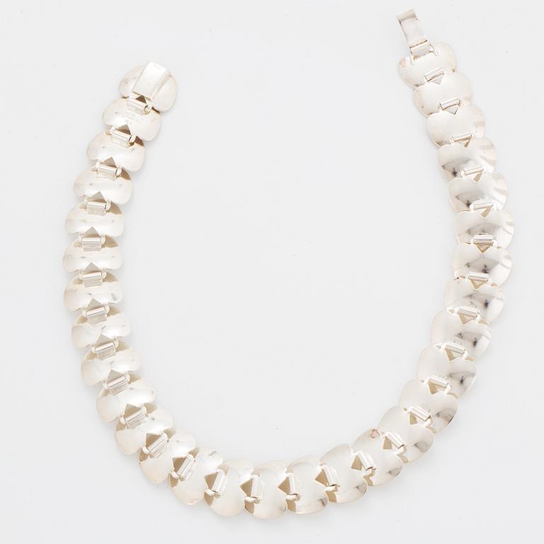 A silver necklace by Viggo Wollny.