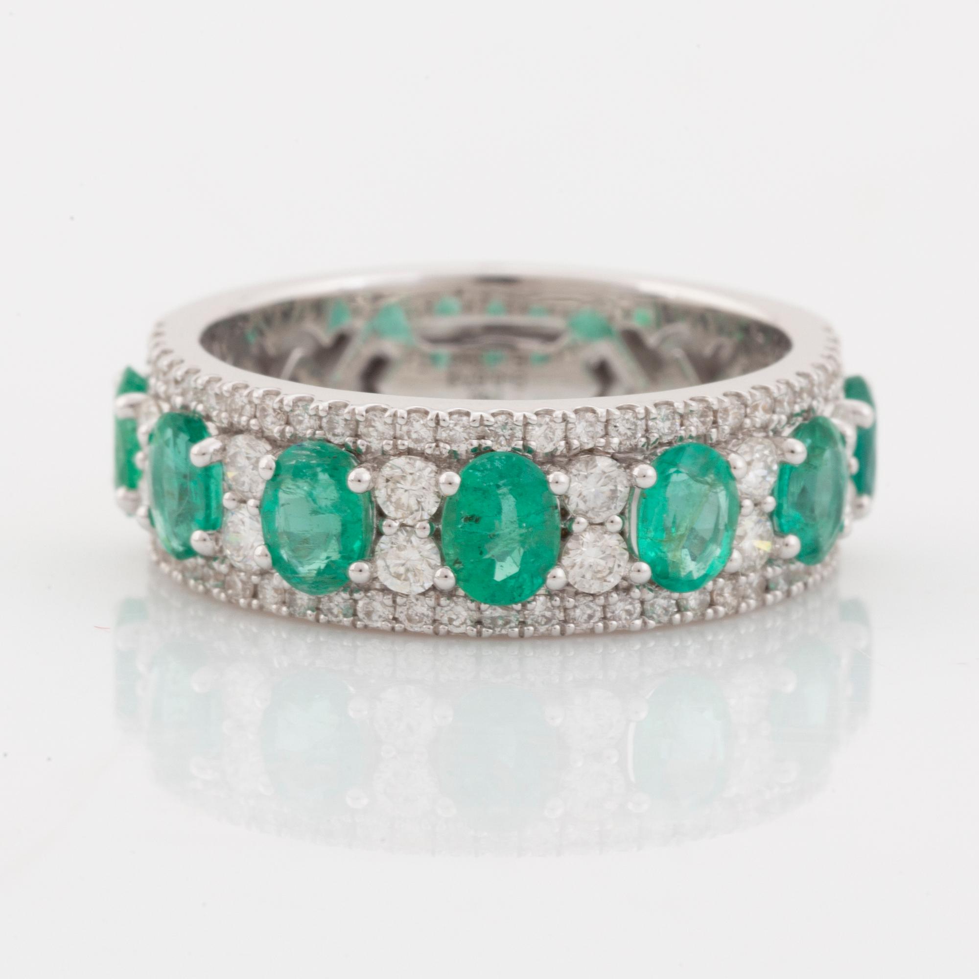 Emerald and brilliant cut diamond ring.