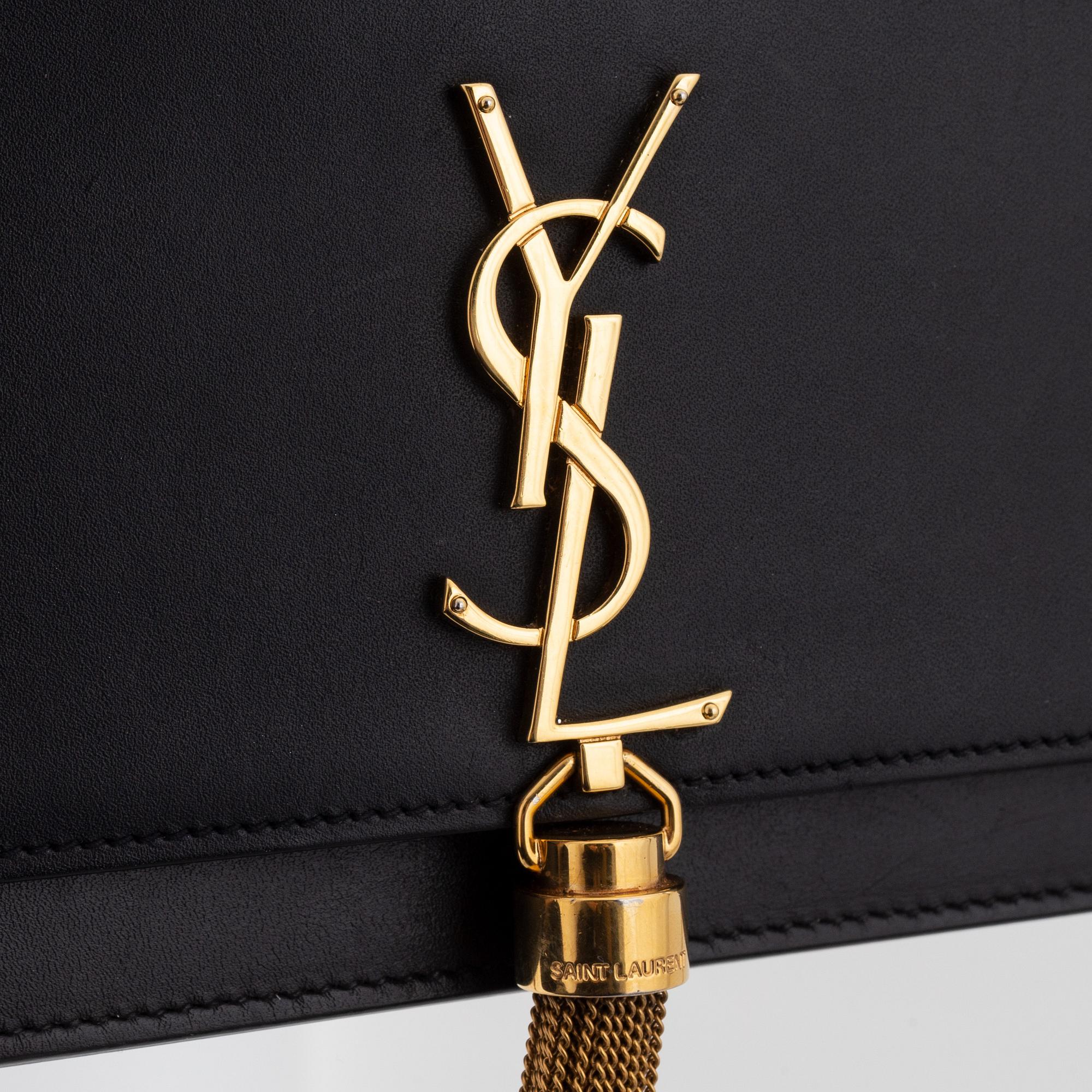Yves Saint Laurent, a black leather 'Kate Medium' clutch,.