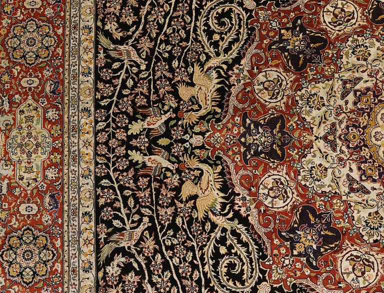 A oriental silk carpet, 303 x 201 cm.