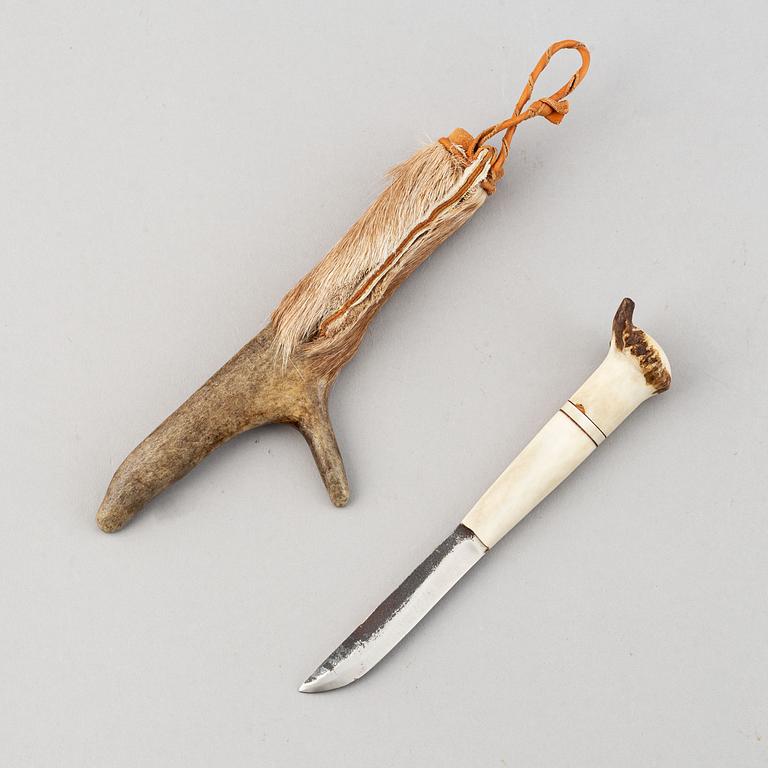 Erik Tuolja, two Sami reindeer horn, birch wood, fur and leather knives, one signed ET.