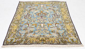 A Ghom figural rug, c. 202 x 132 cm.