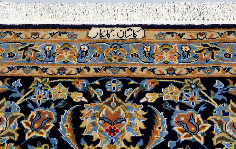 A Keshan carpet, signed, approx. 600 x 400 cm.