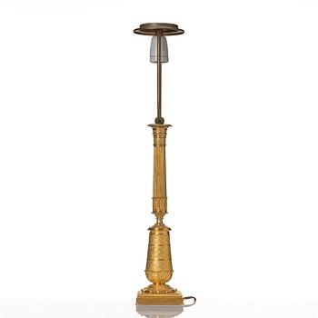 An gilded Empire table lamp.