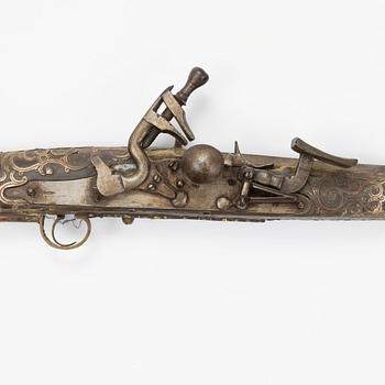 A snaphaunce gun, 19th Century.