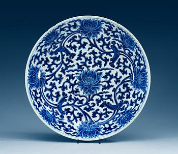 A large blue and white charger, Qing dynasty, with Kangxis six character mark and period (1662-1722).