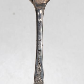 Seven silver spoons, including English and Swedish hallmarks.
