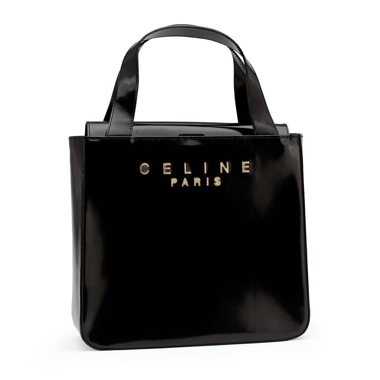 CÉLINE, a black patent leather purse.