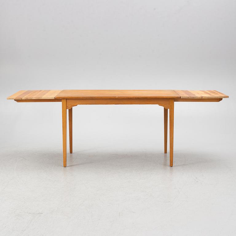 Carl Malmsten, dining table and four chairs, including Svensk Fur, second half of the 20th century.