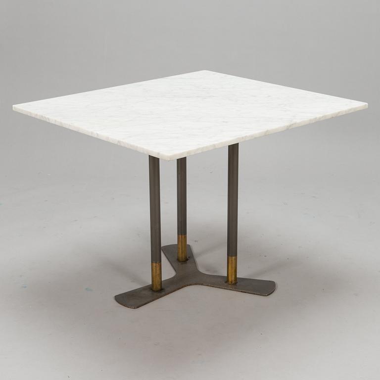 A marble top table, 21th century.