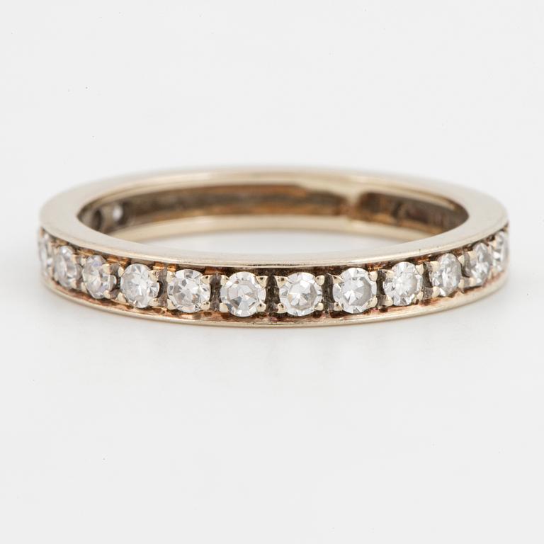 Half-eternity white gold with eight-cut diamond ring.