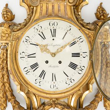 A Gustavian style gilt wood wall clock by Robert Engström, Stockholm, first half of the 20th Century.
