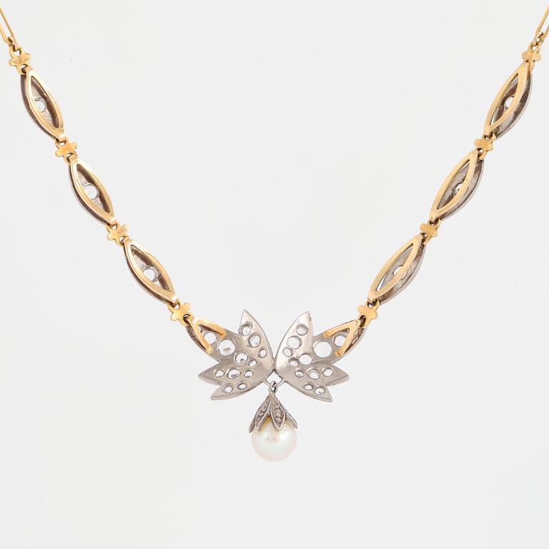 18K gold necklace with white stones and pearl.
