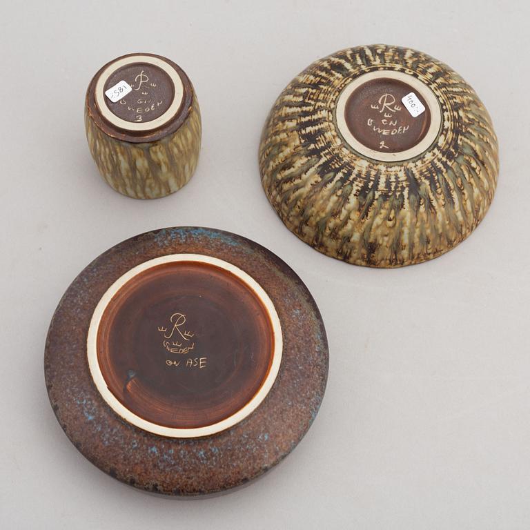 Gunnar Nylund, a set of two stoneware ashtrays, three bowls, a jug and a vase, Rörstrand.