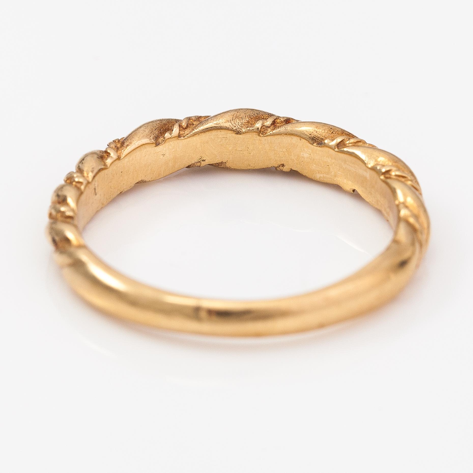 An 18K gold ring "Twined jewellery from Lampola in Halikko". Kalevala koru, Helsinki 1978.