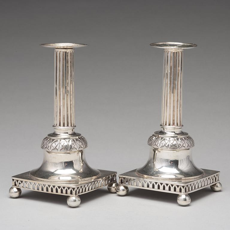 A pair of Swedish aerly 19th century silver candlesticks, mark of Carl Gustaf Blomborg, Stockholm 1815.