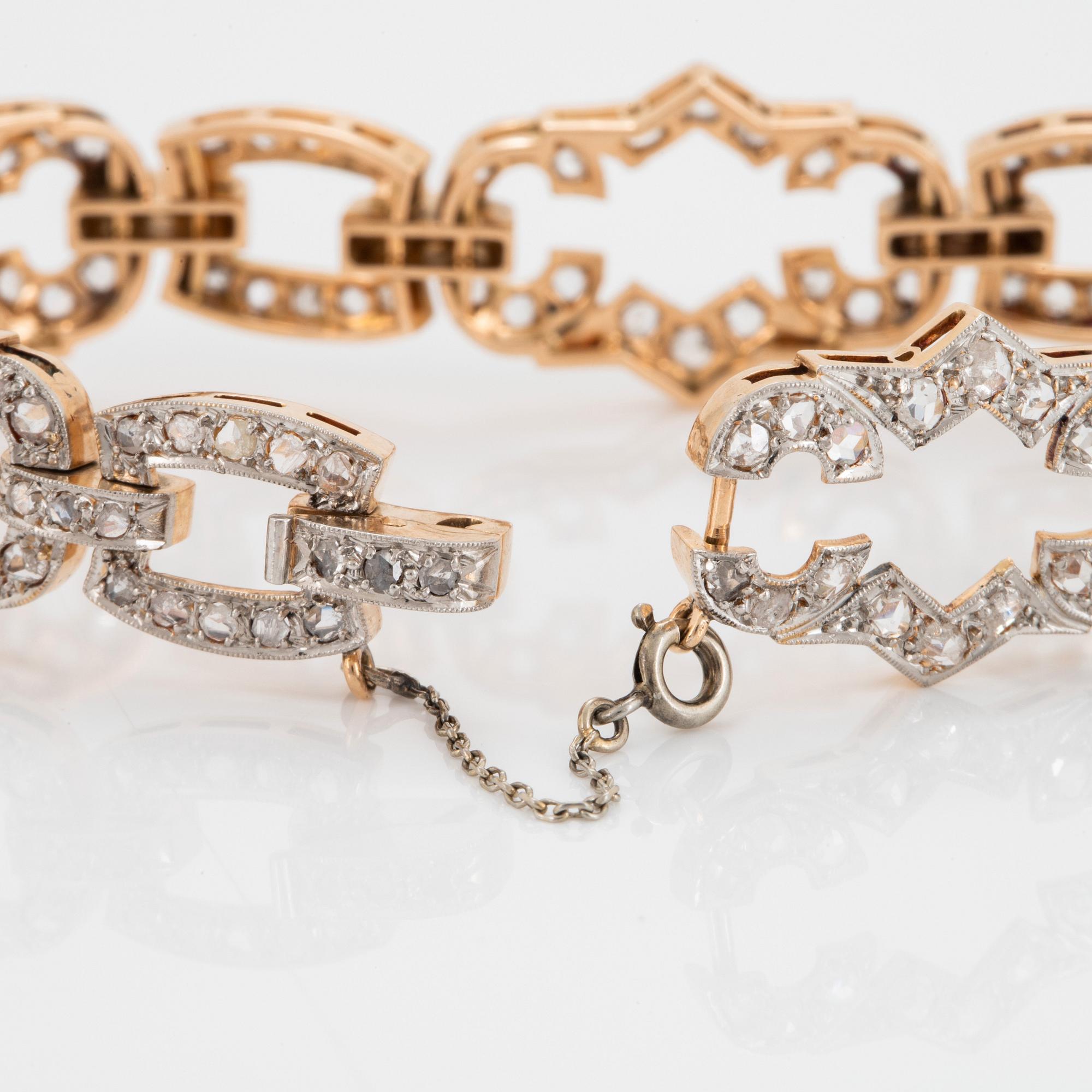A 14K gold and platinum bracelet set with rose-cut diamonds.