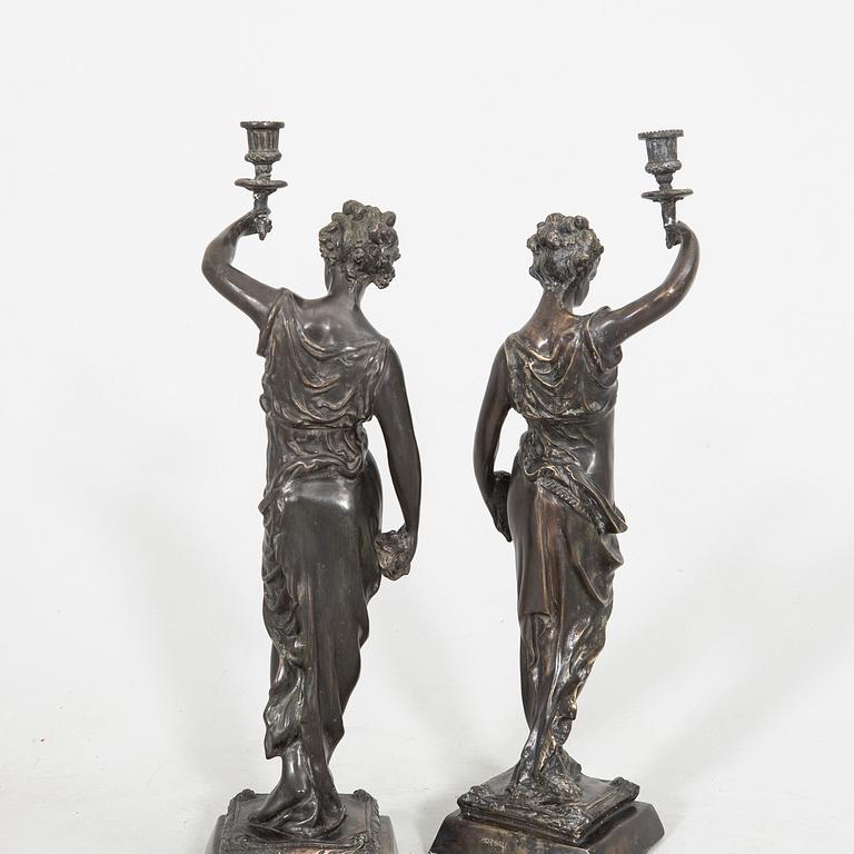 Auguste Moreau after a pair of sculptures/candle sticks patinated bronze.