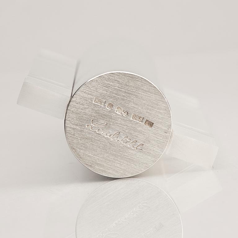 A sterling silver and acrylic bottle with lid, mark of Rolf Lindståhl, Stockholm 2003.