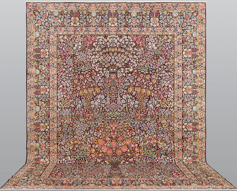 A Kirman Laver carpet, 'Millefleur', approx. 400 x 295 cm.
