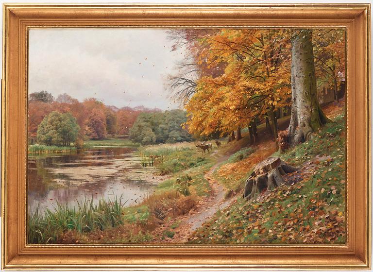 Peder Mork Mönsted, Autumn day in the forest, red deer by a lake.