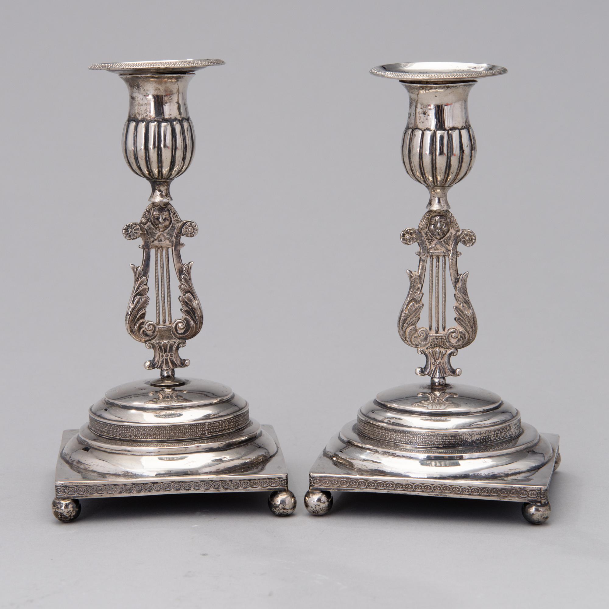 A PAIR OF FINNISH SILVER CANDLESTICKS, Wilhelm Fahlström 1818-1828, Helsinki.