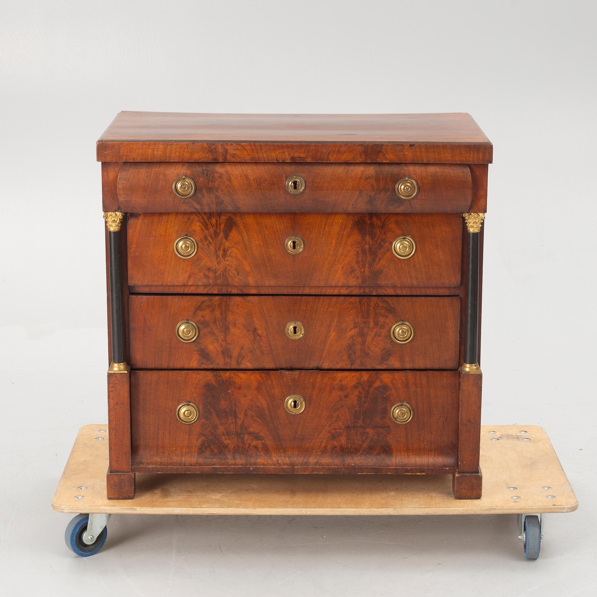 An Empire chest of drawers, first half of the/mid 19th century.