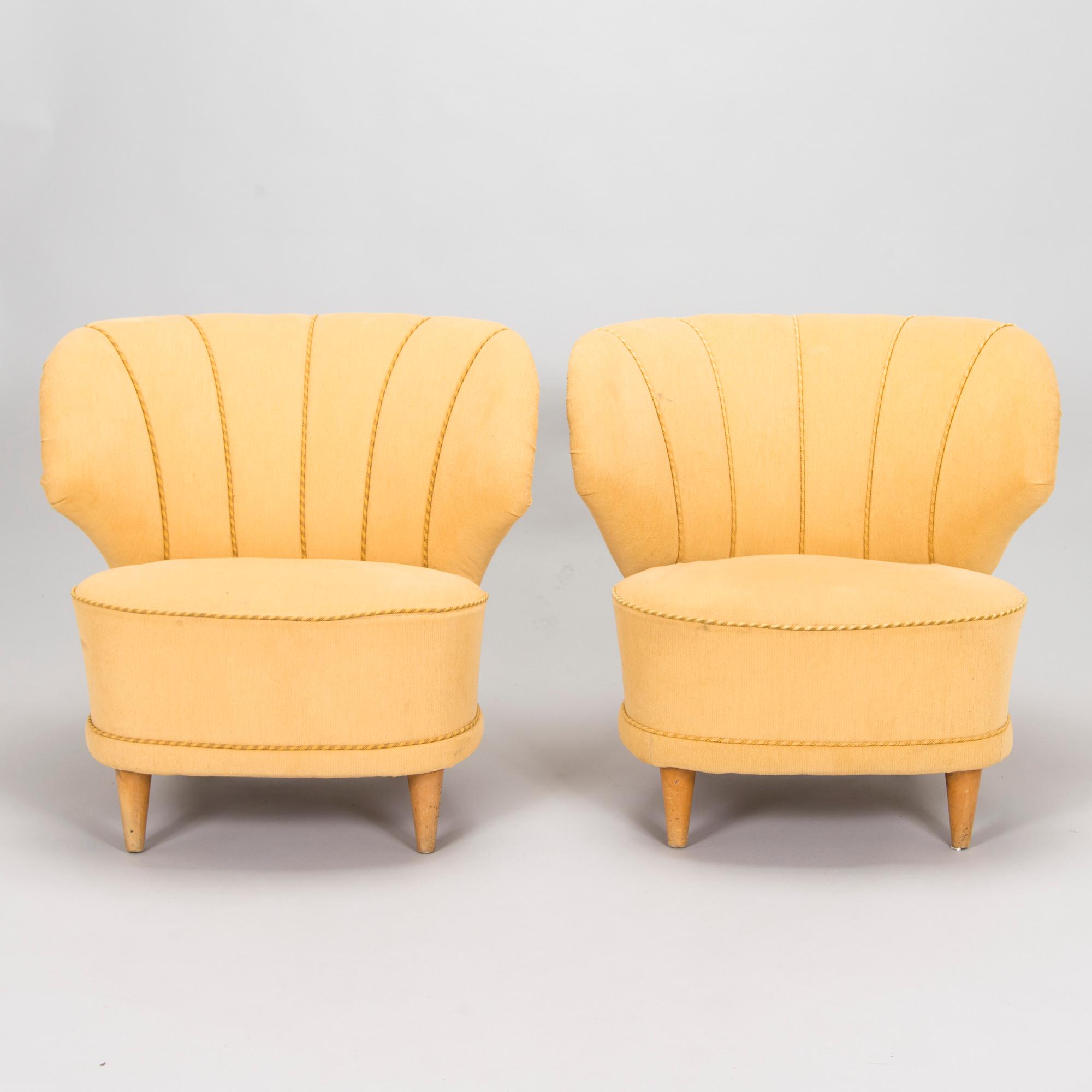 A pair of mid-20th century armchairs.
