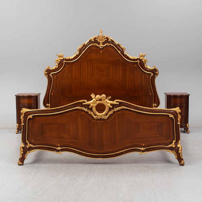 a set of a mahogany veneered and guilded rococo-style bed and two bedside tables.