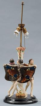 A Josef Lorenzl "The captured bird" triple figural lamp, Goldscheider, Wien circa 1925.