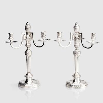 250. A pair of Austrian Royal, Three-armed silver candelabras, marks of lgnaz Joseph Würth, Vienna 1779.