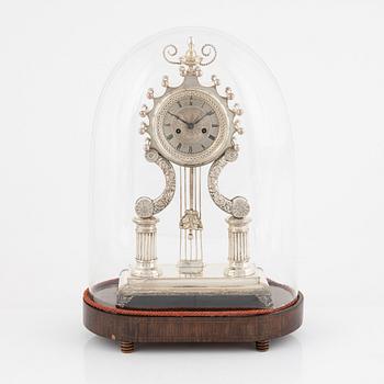 A silver-plate table clock, Empire, mid 19th century.