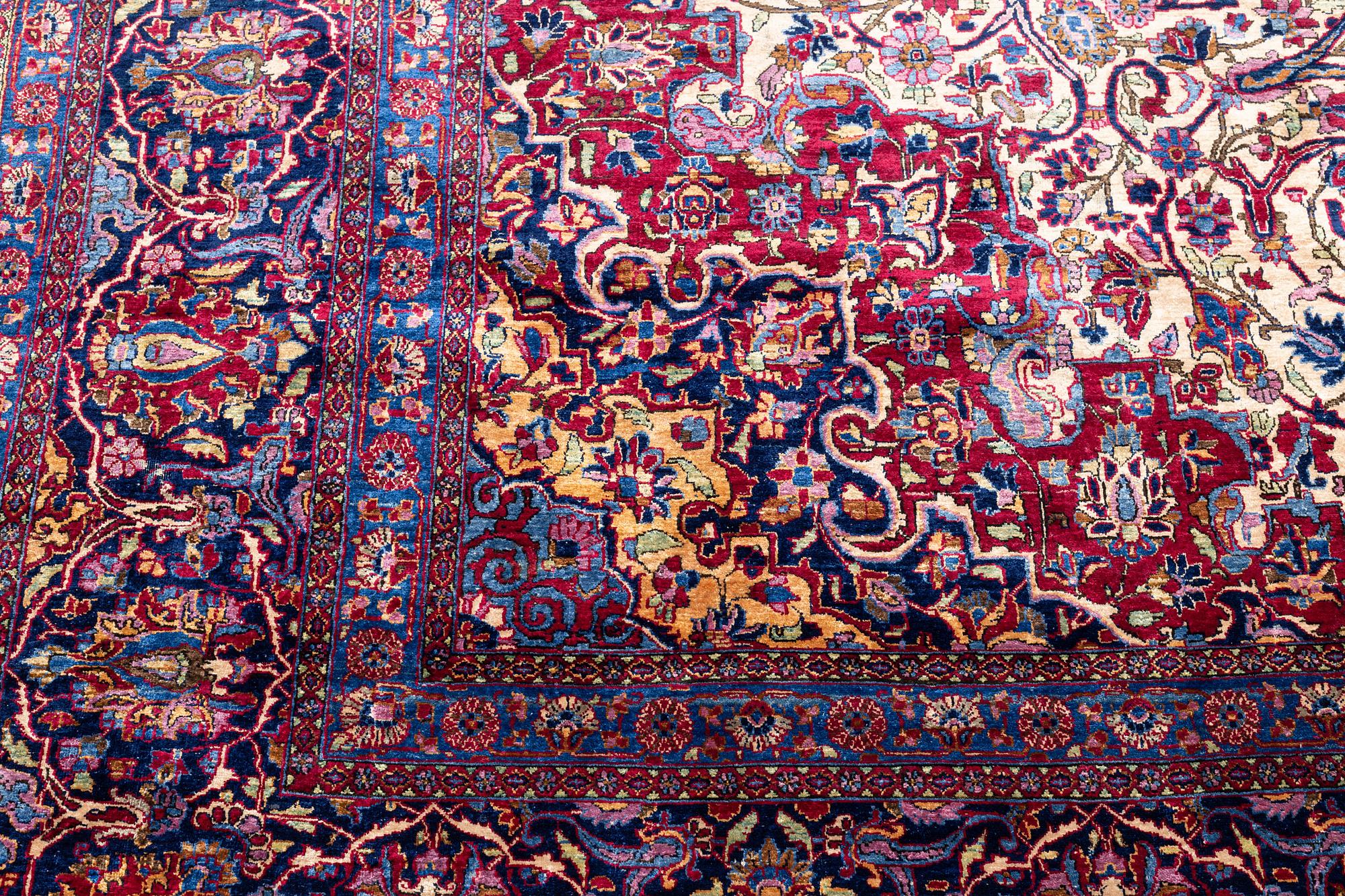 An antique silk Kashan carpet, central Persia (Iran) c. 378 x 259 cm.