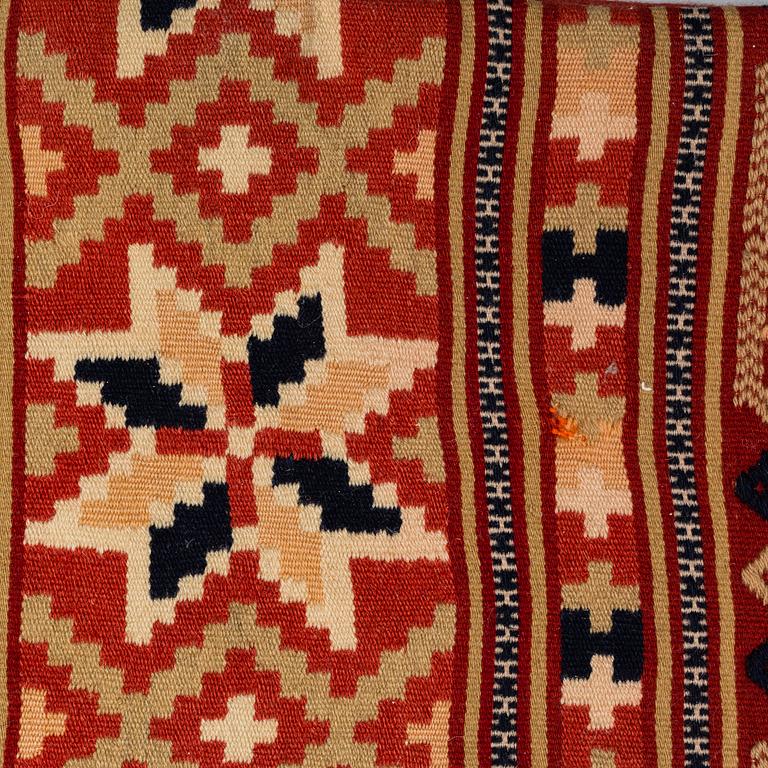 A carriage cushion, flat weave, ca 47-49,5 x 100 cm, Scania, Sweden, around 1900.