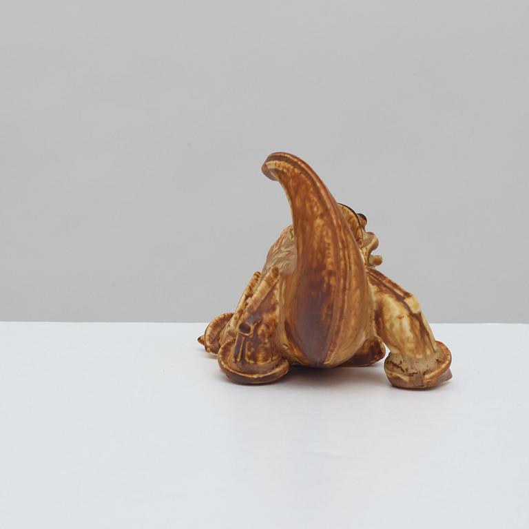 A Wilhelm Kåge stoneware figure of a dragon puppy, Gustavsberg 1940's.