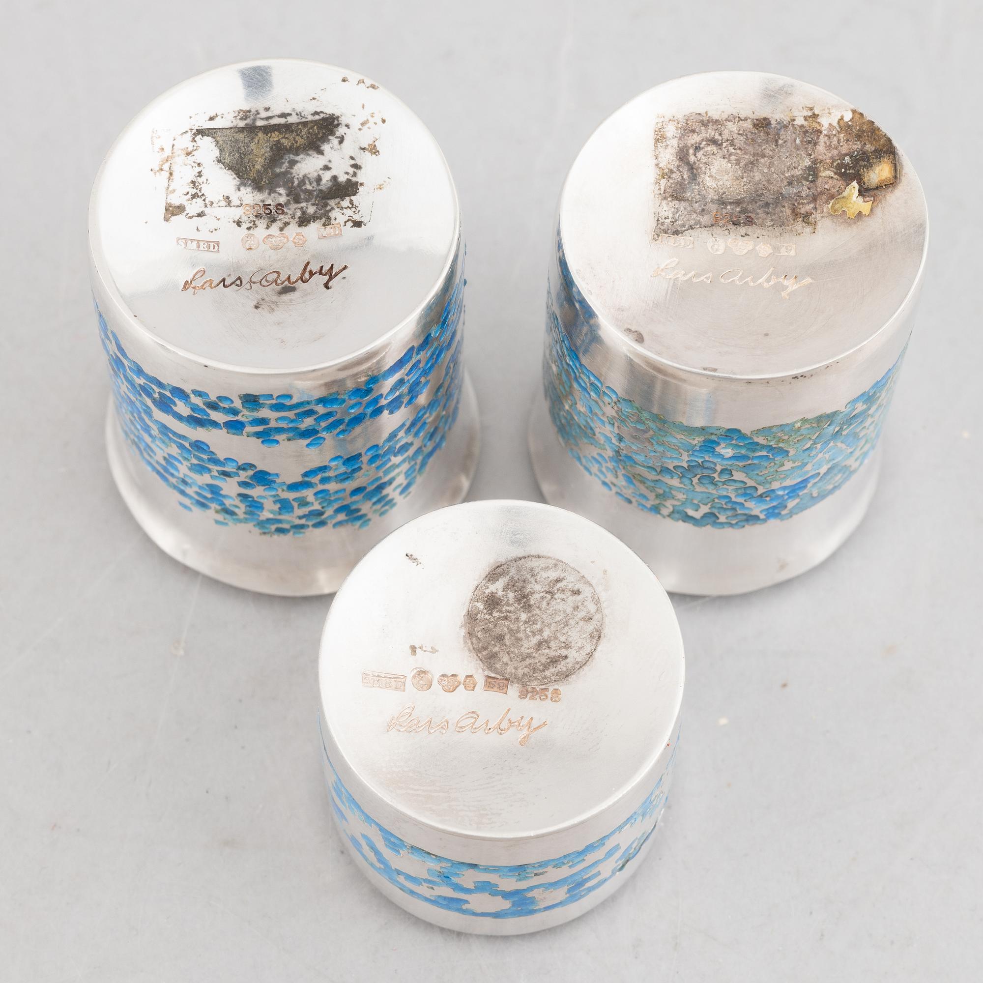 Two sterling silver and enamel miniature beakers and a small box with lid, marks of Lars Arby, Gothenburg, Sweden.