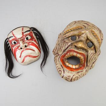 A group of dancing maskes, mostly Japanese Bugagku masks, Meiji period (1868-1912).