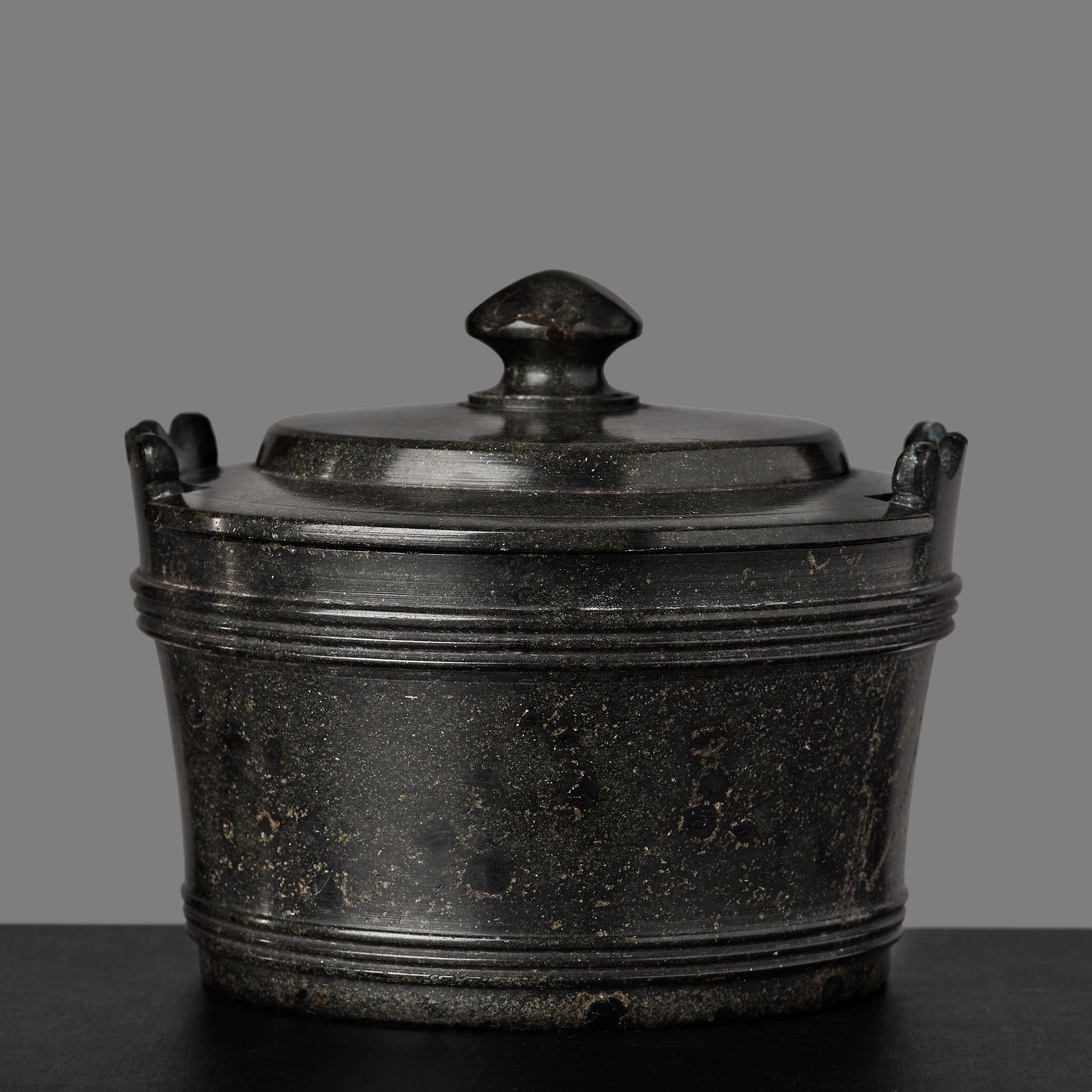 A serpentine stone butter box and cover circa 1800.