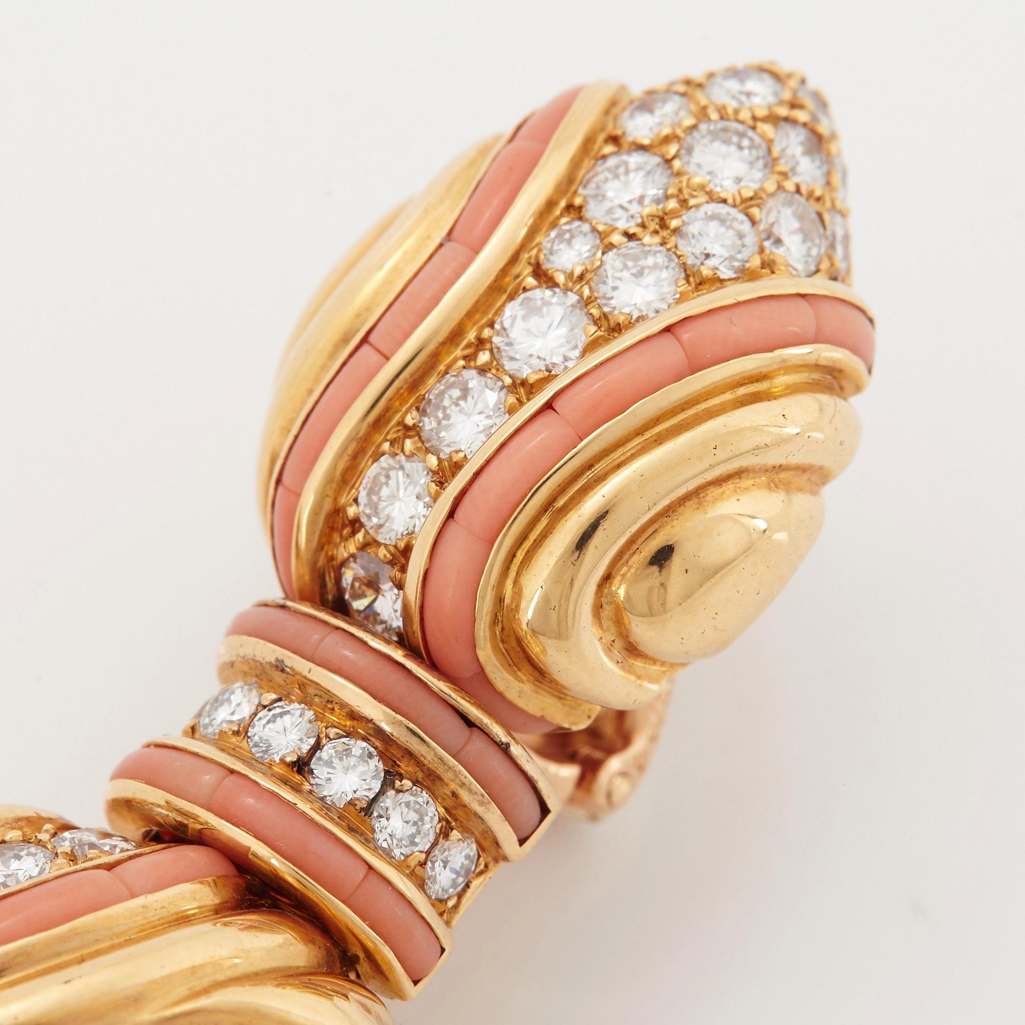 A pair of 18K gold Boucheron earrings set with round brilliant-cut diamonds and coral.