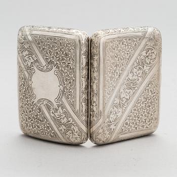 An English sterling silver cigarette case, maker's mark William M. Hayes, of Birmingham, 1896.