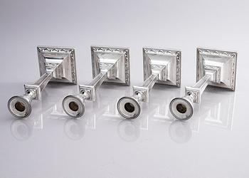 Four early 20th century silver candlesticks, marks of Hawksworth, Eyre & Co Ltd, Sheffield, England 1904-1906.