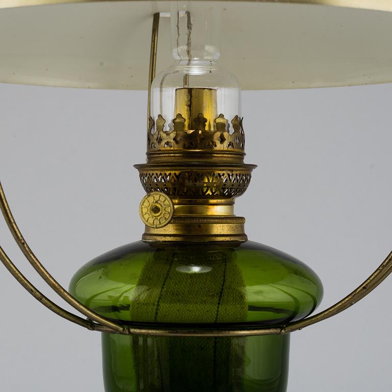 a paraffin ceiling light, brass and glass.