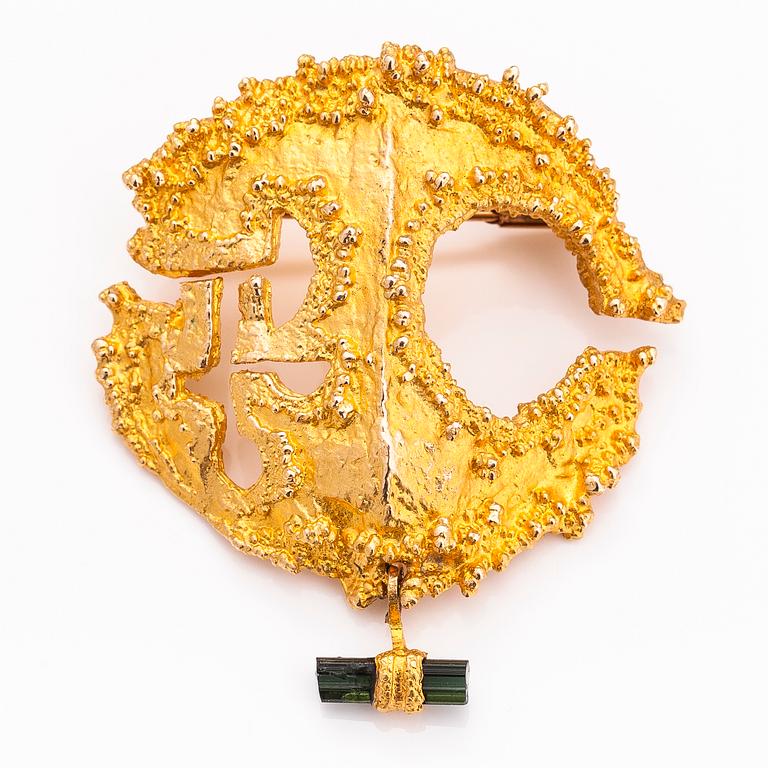 BJÖRN WECKSTRÖM, A 14K gold brooch "Sun of the Incas" with a tourmaline. Lapponia 1972.