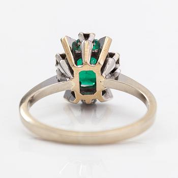 An 18K white gold ring with diamonds ca 0.06 ct in total and emerald triplet.