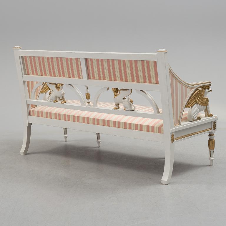 A set of two armchairs, a sofa, a stool and a chair. Early 20th century.